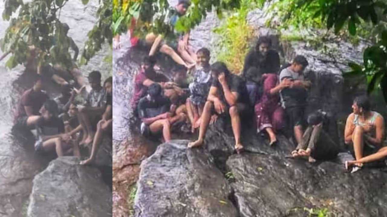 Tourists Trapped in Flash Flood: വെള്ളച്ചാട്ടം ആസ്വദിക്കാനെത്തിയ വിനോദ സഞ്ചാരികൾ മലവെള്ളപ്പാച്ചിലിൽ കുടുങ്ങി;  രക്ഷകരായി അ​ഗ്നിശമന സേന