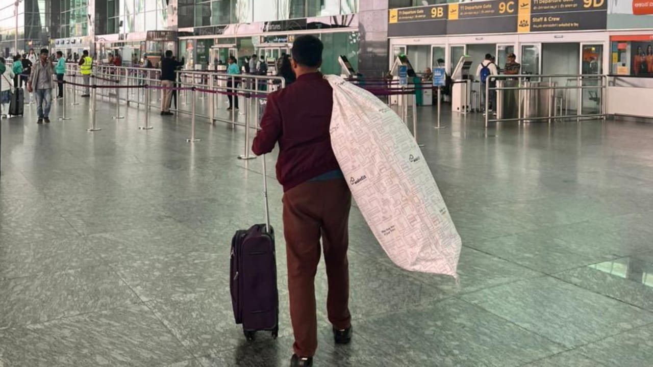 Traveller With Mattress In Airport