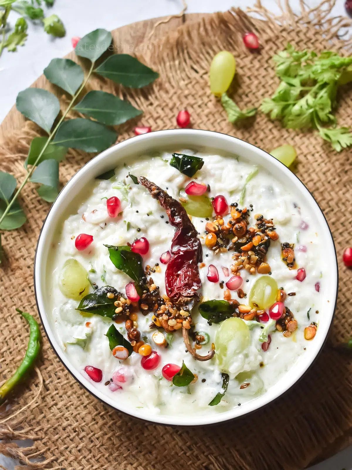 തയാറാക്കുന്ന വിധം:തൈര് സാ​ദം തയ്യാറാക്കാനാായി ആദ്യ അരി നല്ലതുപോലെ കഴുകിവൃത്തിയാക്കി 20 മിനിറ്റ് കുതിർക്കാൻ വയ്ക്കുക. ശേഷം വെള്ളം ഊറ്റിയശേഷം  കുക്കറിൽ ഇട്ട് രണ്ട് കപ്പ് വെള്ളം ഒഴിച്ച് വേവിക്കാൻ വെക്കുക. നാലു മുതൽ അഞ്ച് വിസിൽ വെന്തശേഷം തീ ഓഫാക്കുക. ചോറ്  നന്നായി ഇളക്കി കുഴഞ്ഞ പാകത്തിൽ ആക്കുക. 
